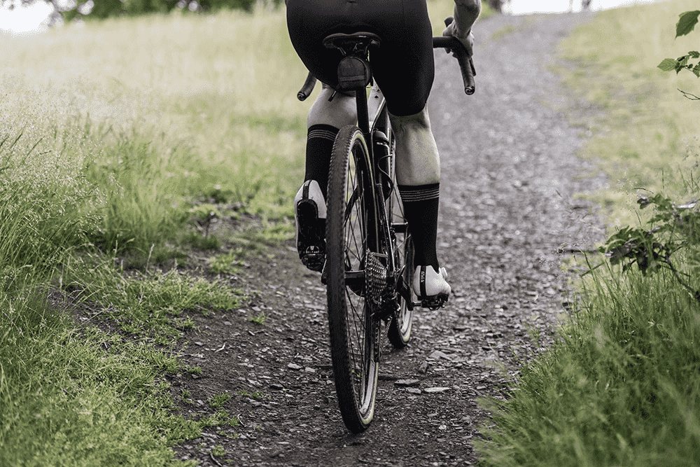 Cyclist riding on a softer terrain, with Vredestein Aventura Grezzo Tyres